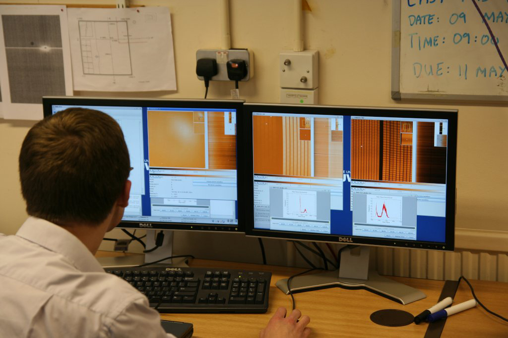 A engineer looking at the first light data from MIRI on the test computer.