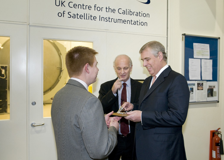 HRH Pince Andrew The Duke of York, being presented with work designed and manufactured in the RAL Space Precision Development Facility