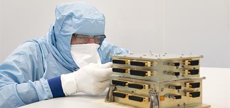 Engineer inspecting black-body unit