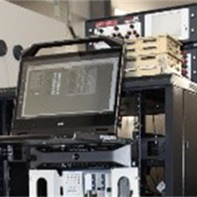 Electrical Ground Support Equipment consisting of a rack of equipment and display screen.