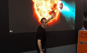 Astronomer Chris Pearson talking about exoplanets at an exhibition.