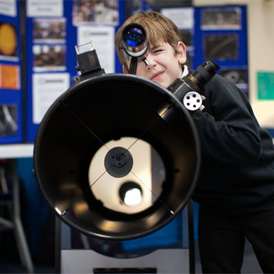 A student using a telescope at the 2020 Stargazing at RAL event.
