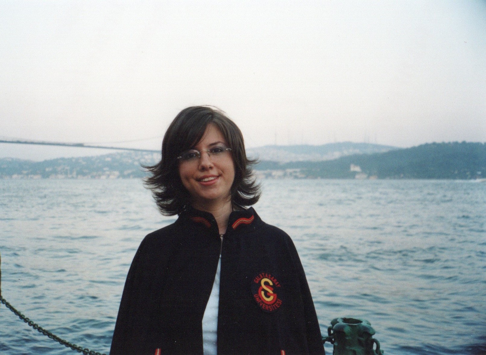 Ceyda Tunarli standing in front of a lake
