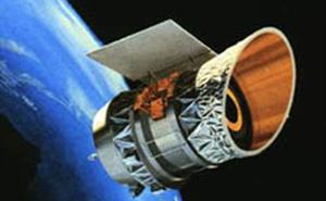 The IRAS space telescope above the Earth.