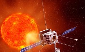 Spacecraft with open solar panels and antennas looking at the Sun.