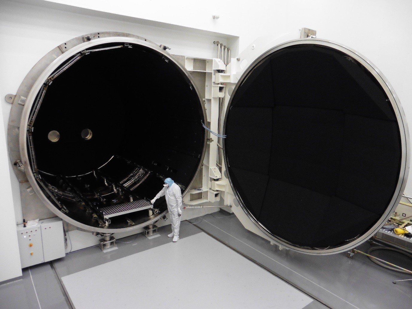 5m wide chamber lined with black shrouds to simulate space.