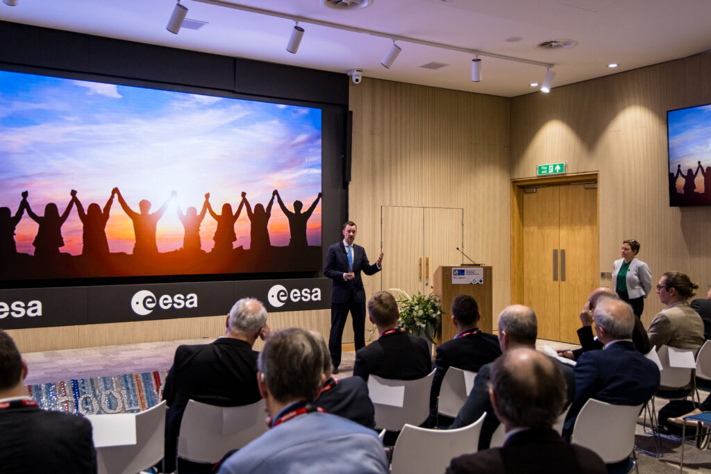 Images show speakers and delegates at the 20th Anniversary