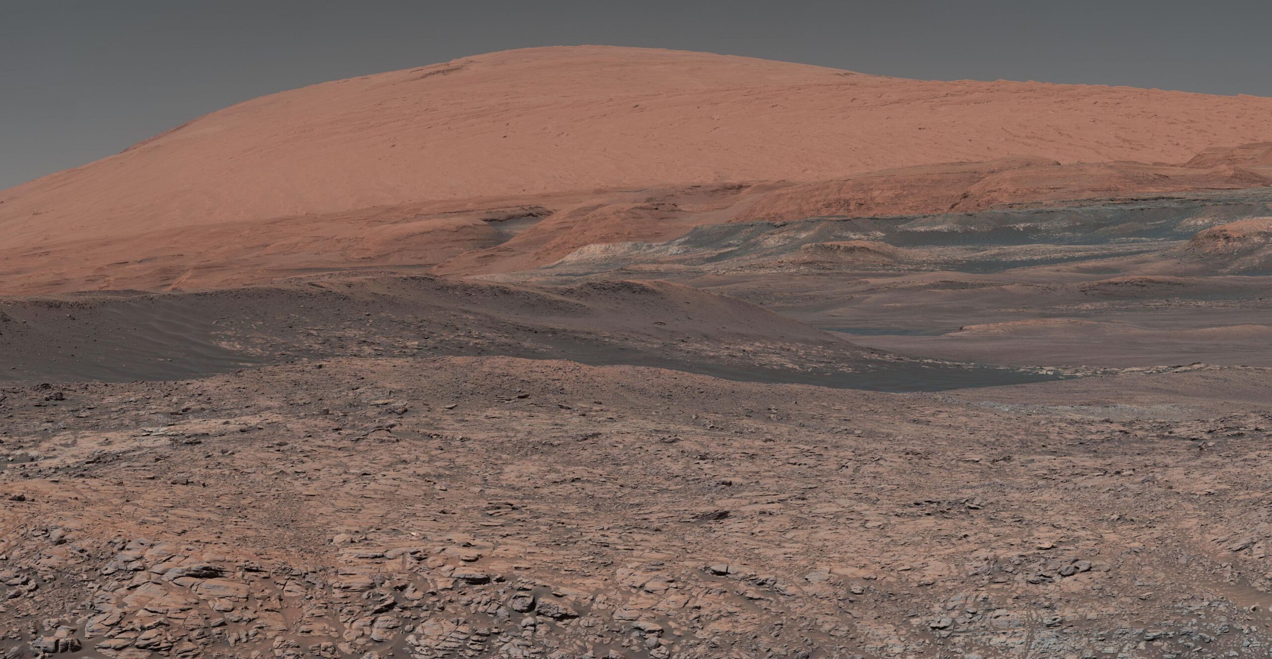 The distinctive red, dusty landscape of Mount Sharp on Mars, captured by the Curiosity Rover.