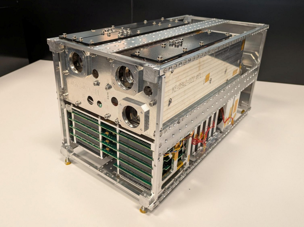 The SOLSTICE payload on a lab bench. It is a relatively small (16U) cubesat structural model.