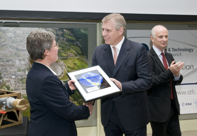 HRH Prince Andrew The Duke of York presents an image of Pulsar B919+21 to Professor Dame Jocelyn Bell Burnell