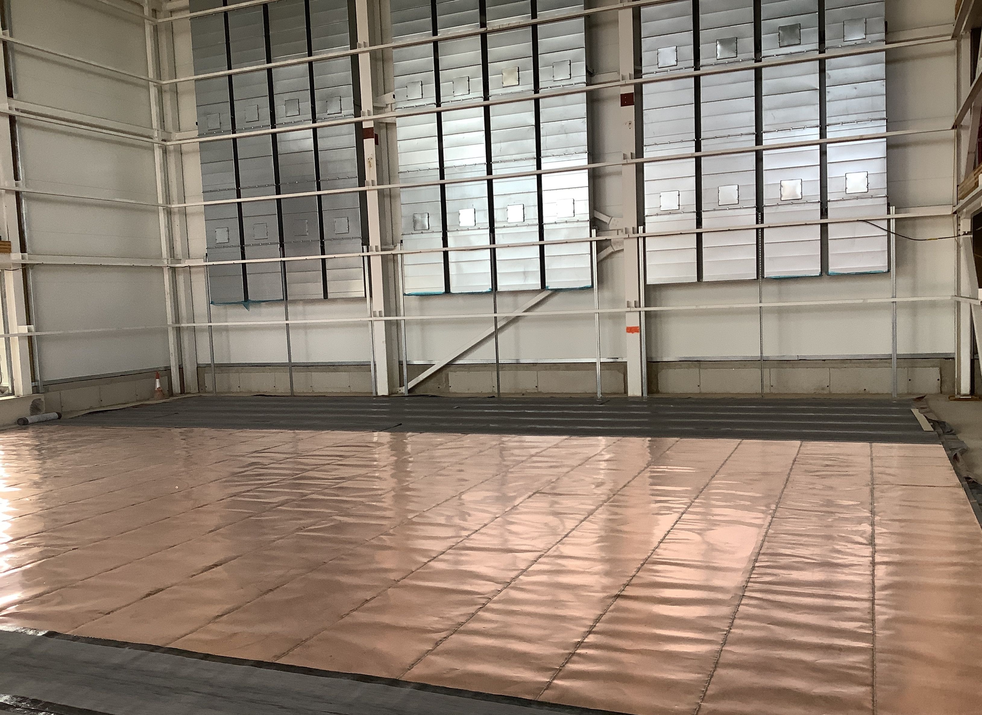 Copper floor of the EMC chamber being laid in August 2020.