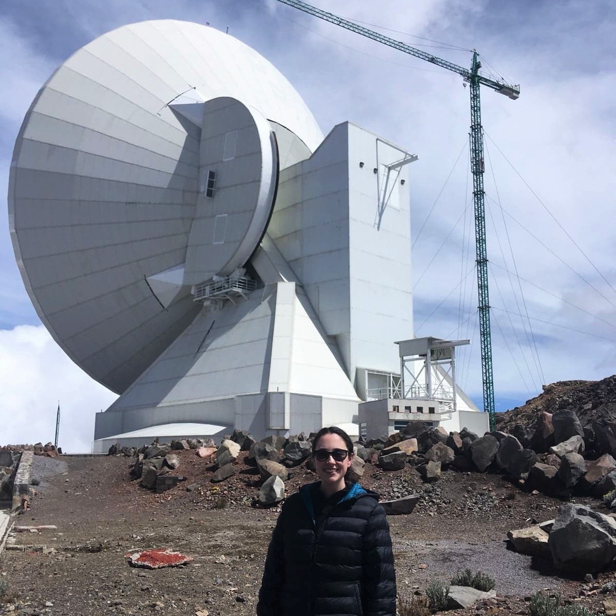 Eimear Gallagher is standing in front of the Large Millimetre Telescope